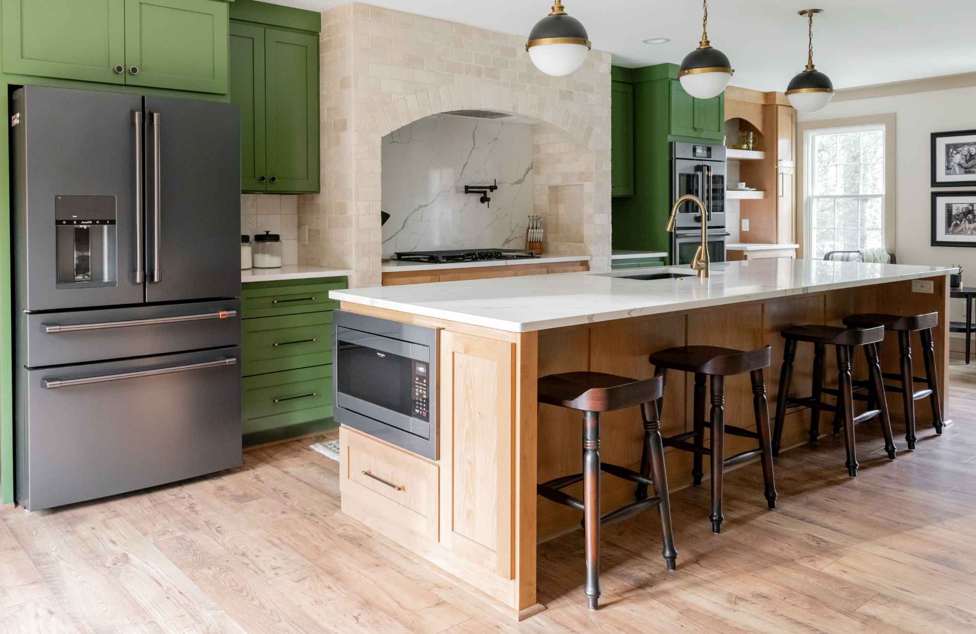 dwelling-place-interiors-leland-nc-finding-the-right-interior-designer-renovated-kitchen-green-cabinets-large-island-spacious-layout-livable-home-remodel